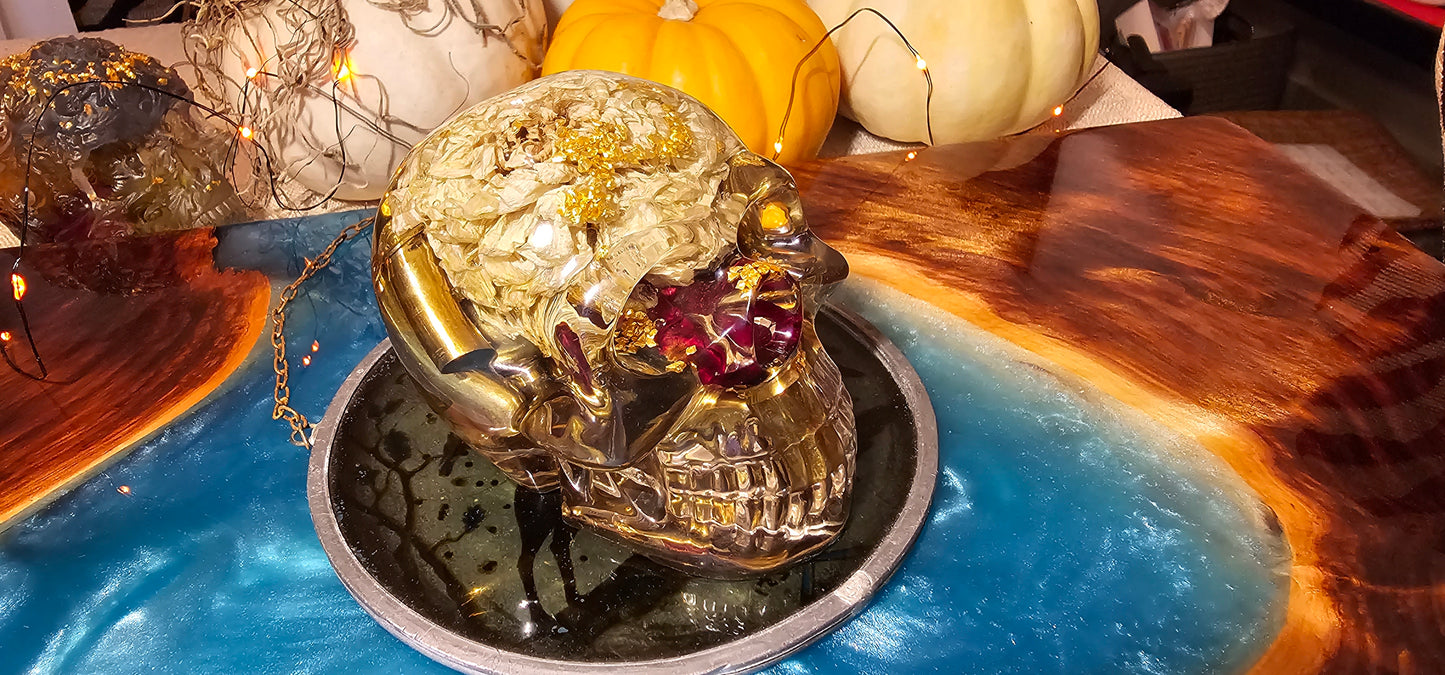 *SOLD*Handmade Resin Skull - With dried wild Rose and flowers. We've also added spent brass shells to help ground the piece and give it different twist.