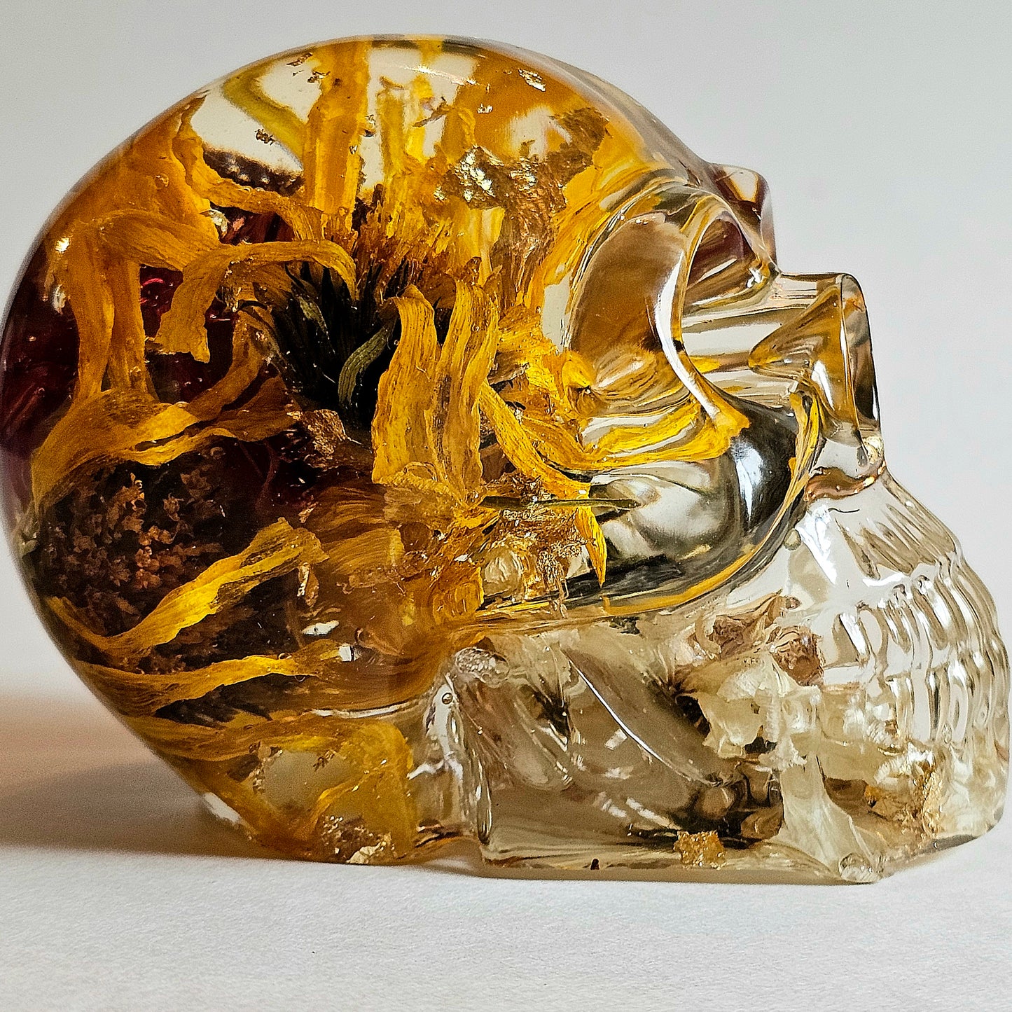 #0000 - Handmade Resin Skull - Mixed flowers in clear resin. Nice detail here.