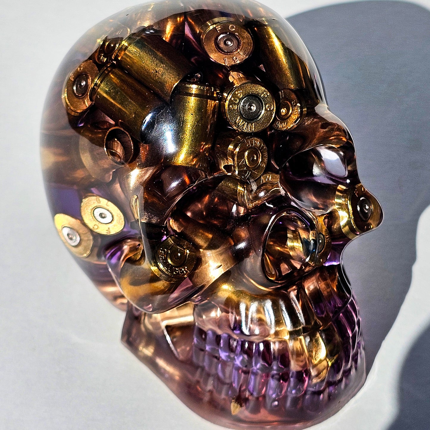 #0284 - Handmade Resin Skull - Mixed large calibre brass, in a light purple resin.