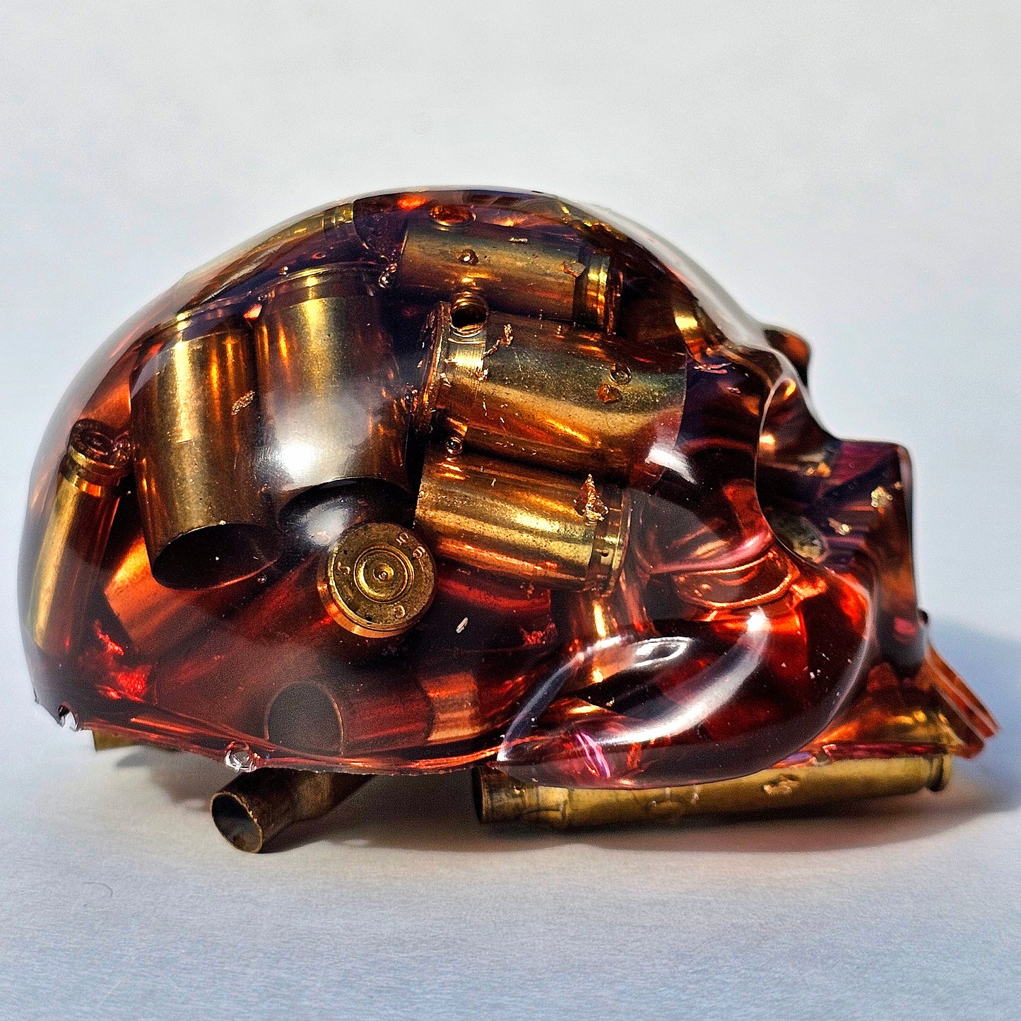 SOLD#0287 - Handmade Resin Skull -    We call it the "Halfer". Fun piece, in red resin with brass hanging out the bottom. Gold accents.