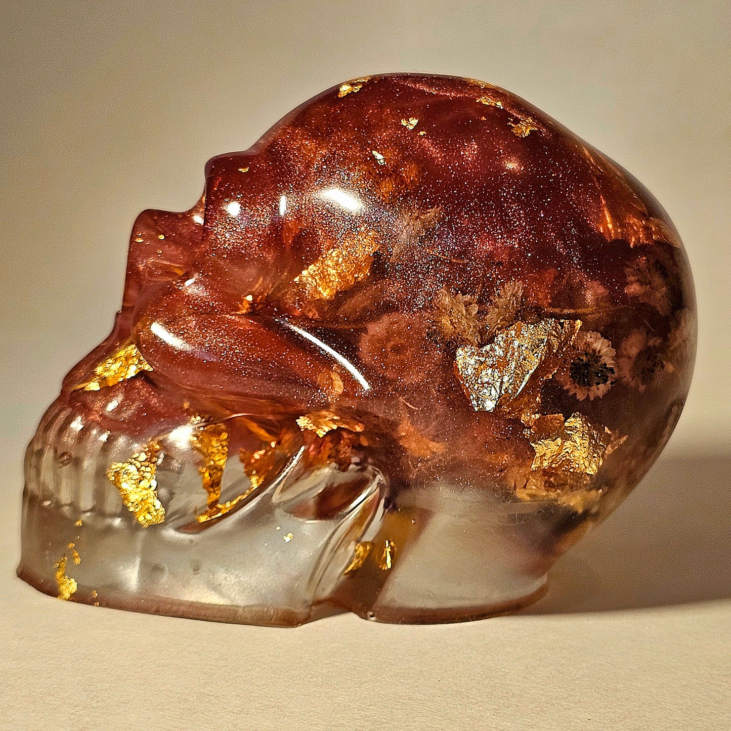 #0260 Handmade Resin Skull - Mixed flowers in warm light red resin.