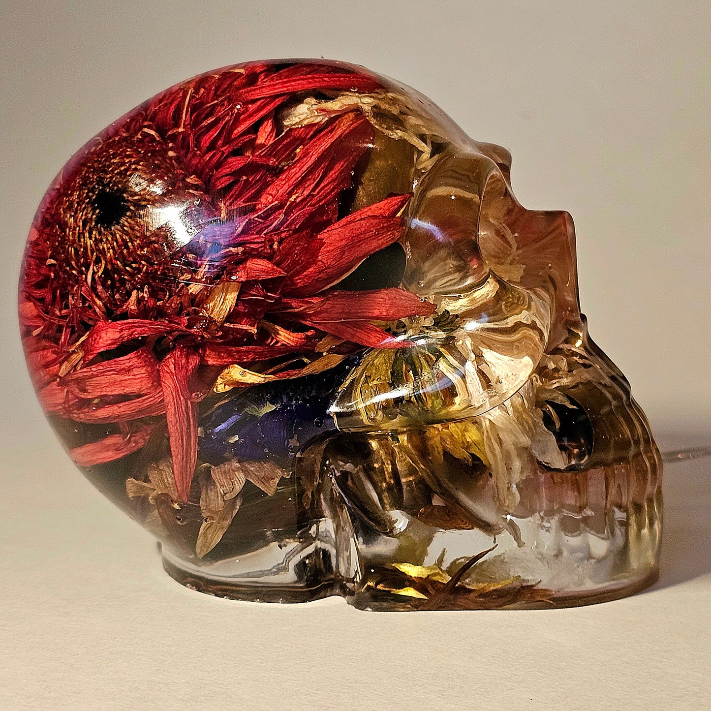 #0263 Handmade Resin Skull - Mixed flowers with brass in clear resin, very nice piece. HAS LIGHTS. Battery operated.