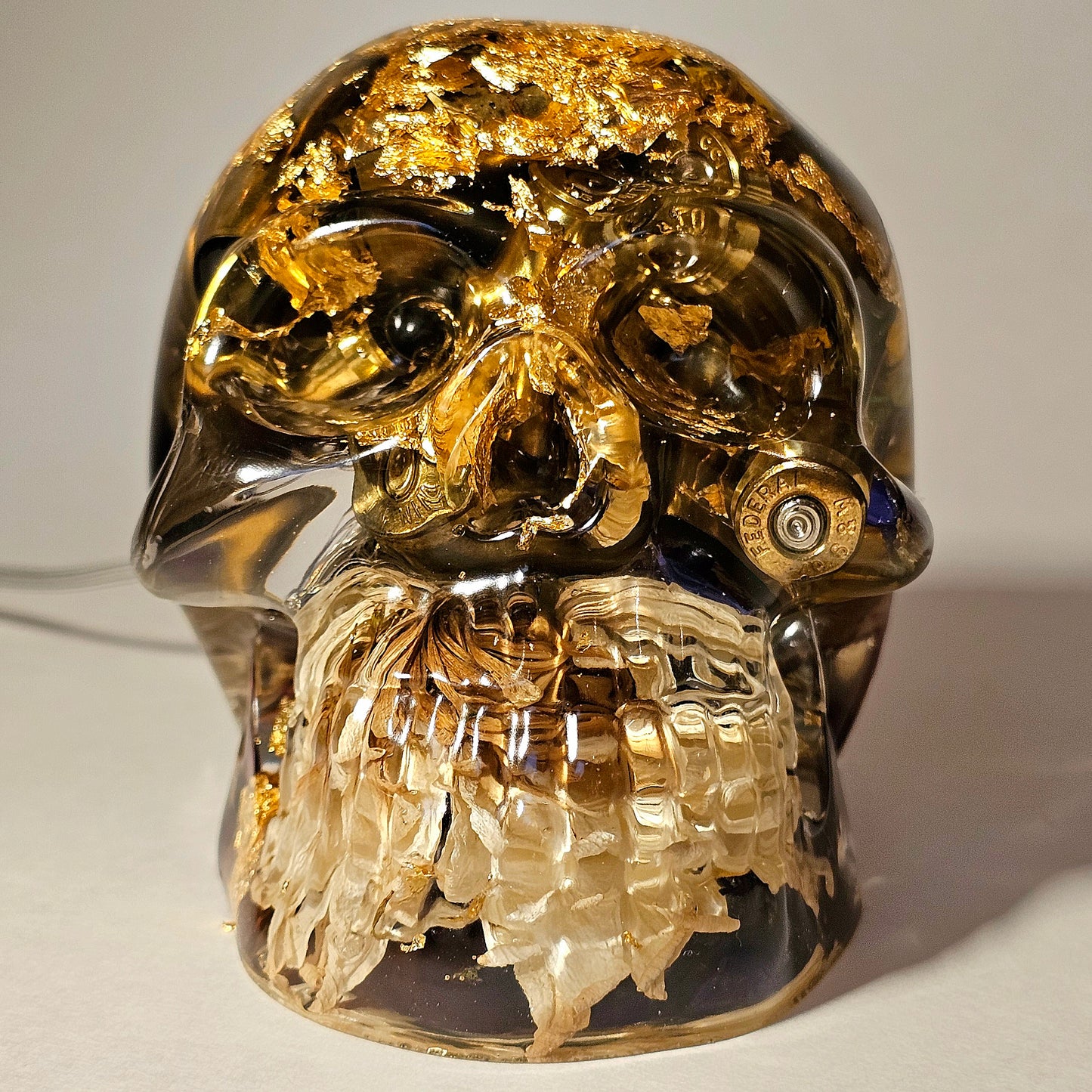 #0268 Handmade Resin Skull - Mixed flowers and brass in clear resin. HAS LIGHTS. Battery operated.