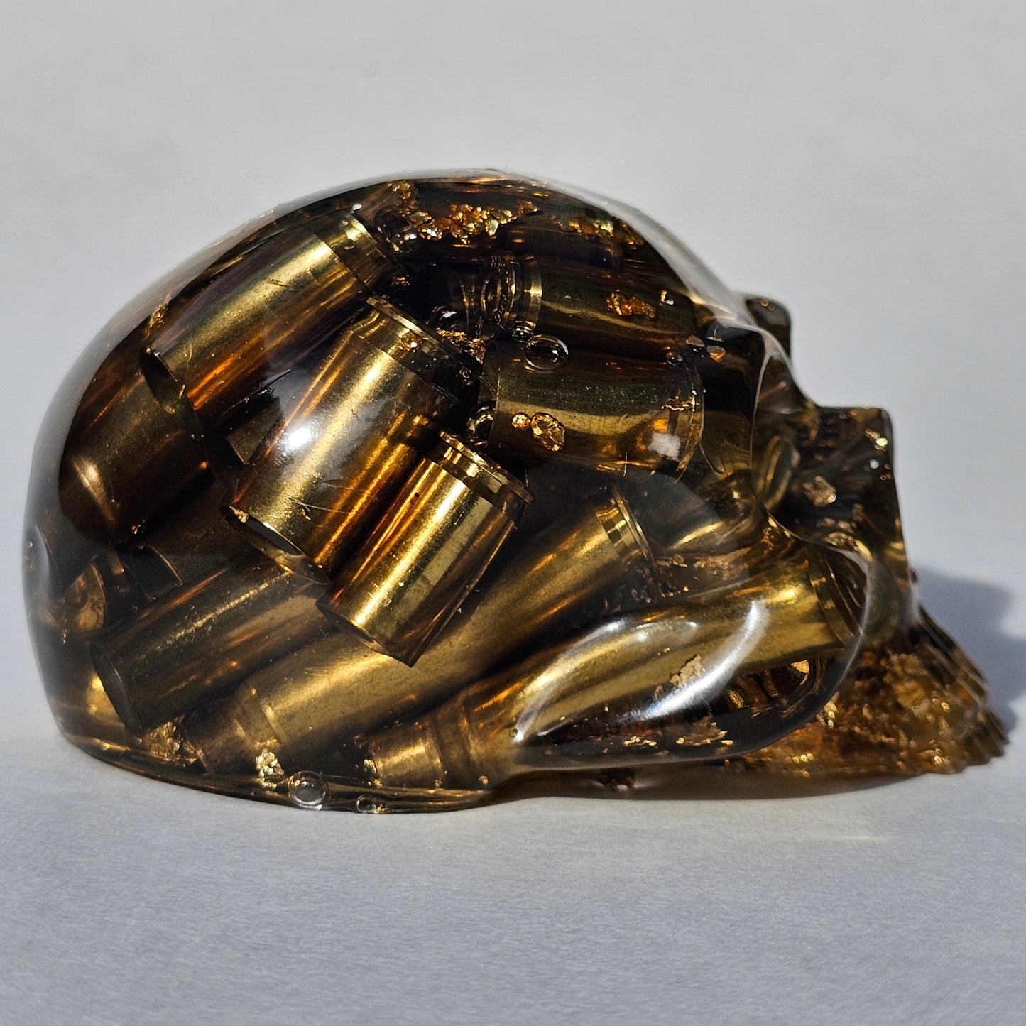 SOLD #0288 - Handmade Resin Skull -    We call it the "Halfer". Fun piece, in clear resin with brass hanging out the bottom. Gold accents.