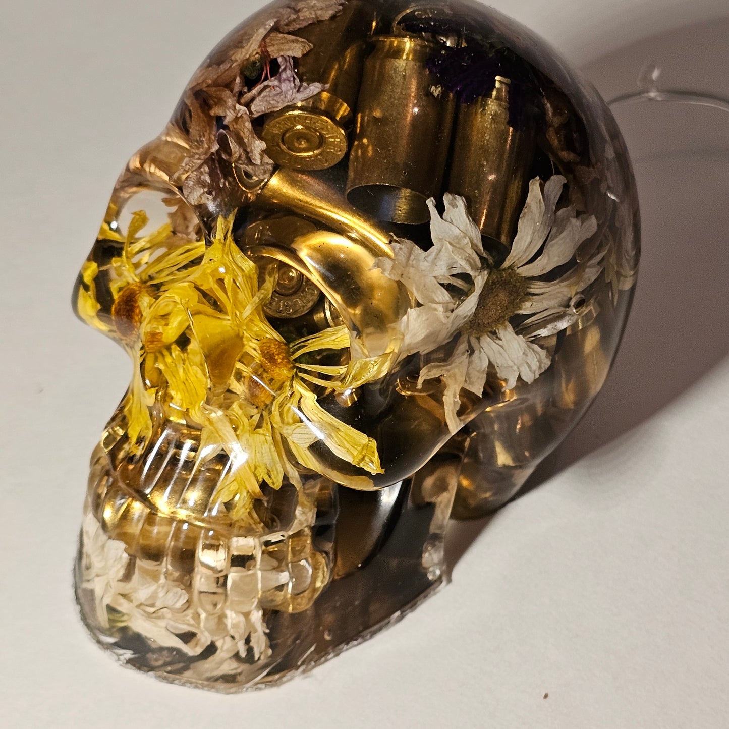 #0266 Handmade Resin Skull - Mixed flowers with brass in clear resin, very nice piece. HAS LIGHTS. Battery operated.