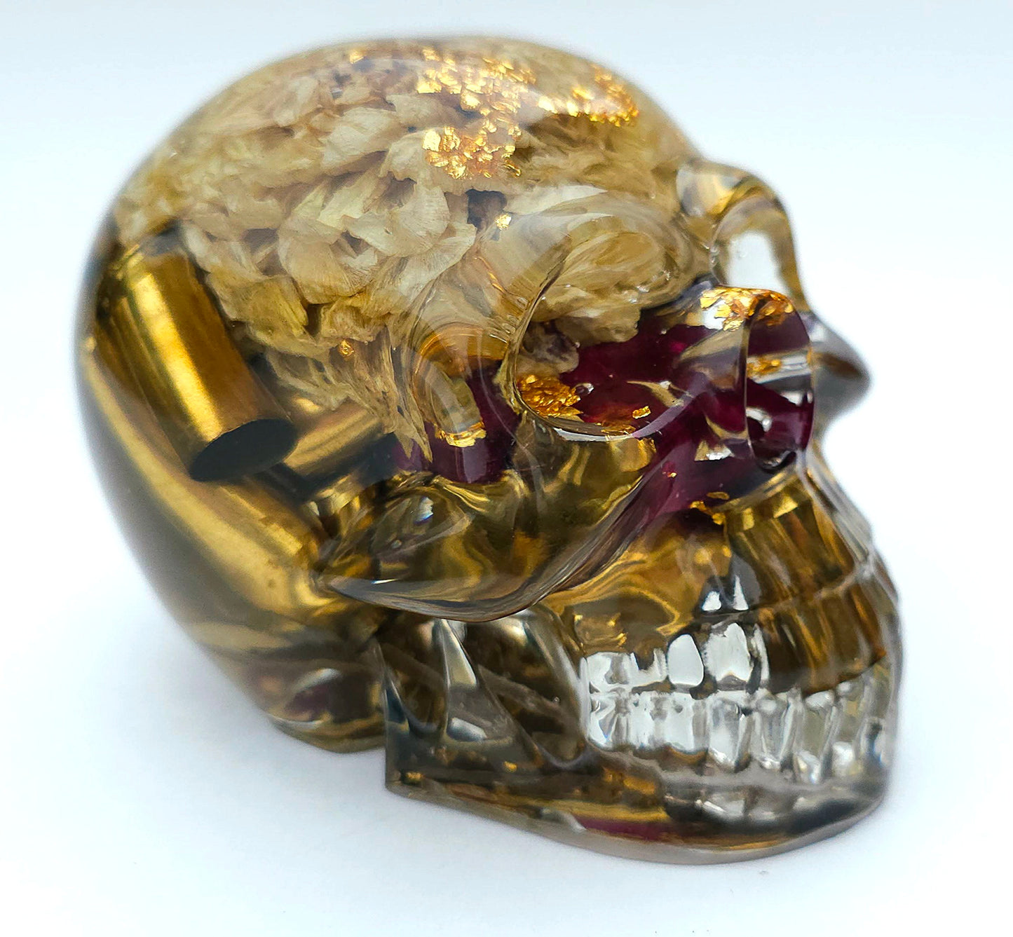 SOLD*Handmade Resin Skull- With wild dried Hydrangea flower mixture.  We've also added spent brass shells to help ground the piece some contrast.