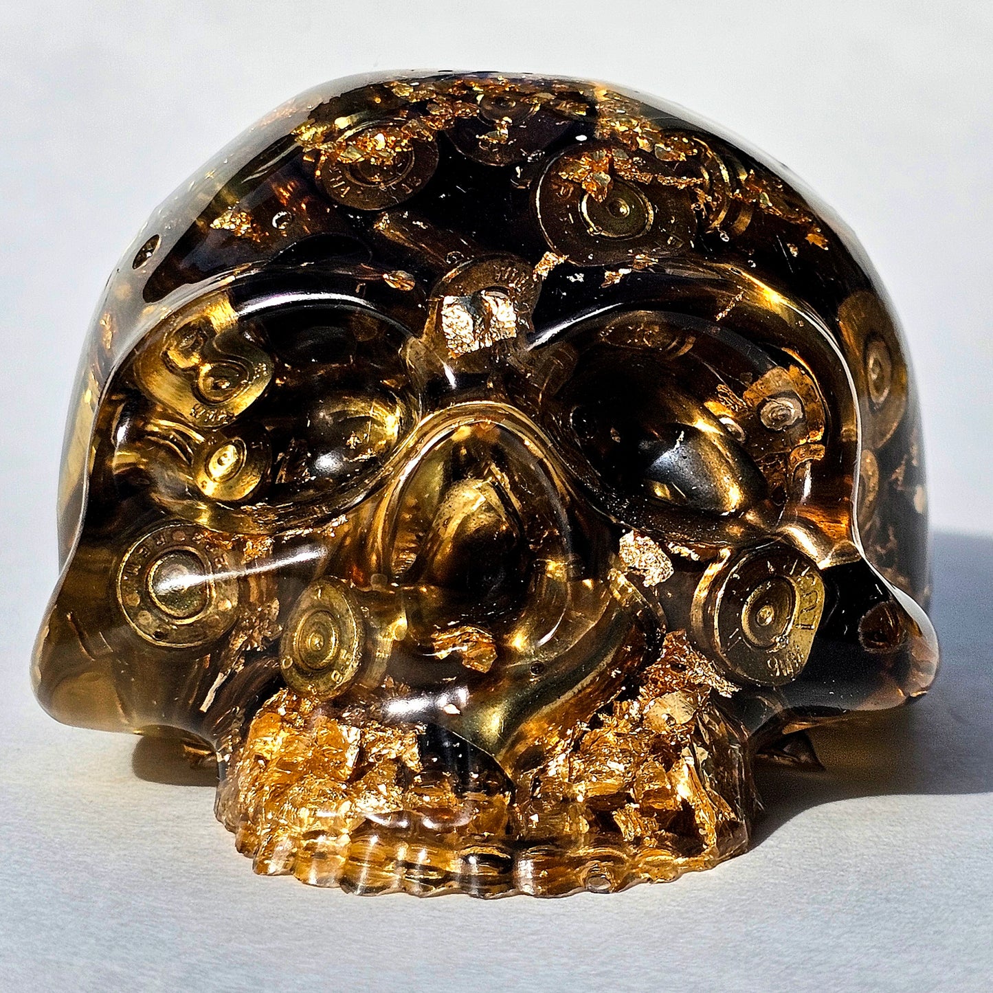 SOLD #0288 - Handmade Resin Skull -    We call it the "Halfer". Fun piece, in clear resin with brass hanging out the bottom. Gold accents.