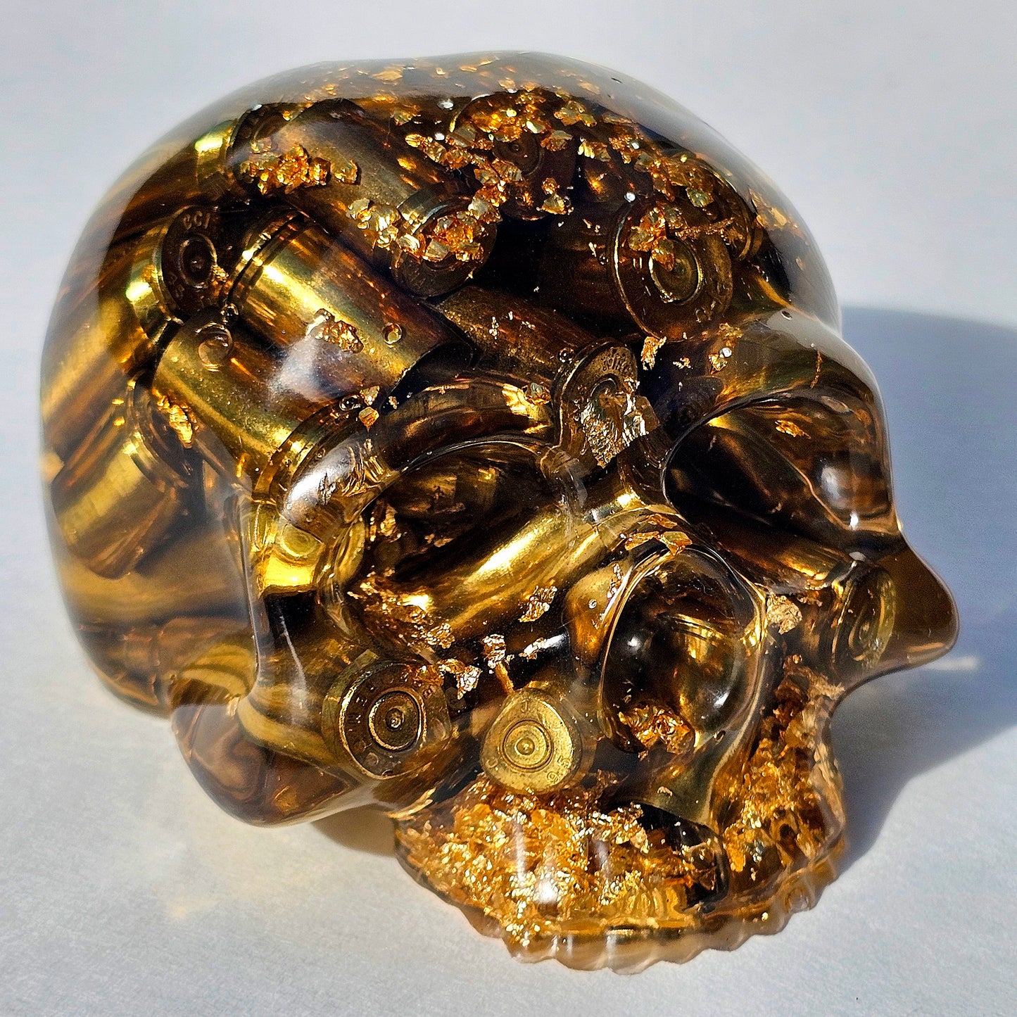 SOLD #0288 - Handmade Resin Skull -    We call it the "Halfer". Fun piece, in clear resin with brass hanging out the bottom. Gold accents.