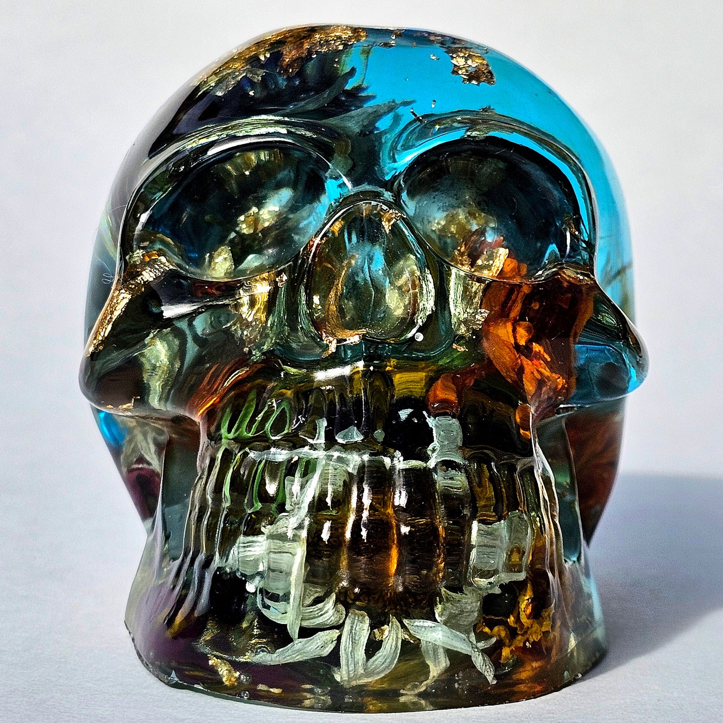 #0289 - Handmade Resin Skull - This one's a bit out there!  Fun piece as well, in blue resin accompanied by mixed flowers.