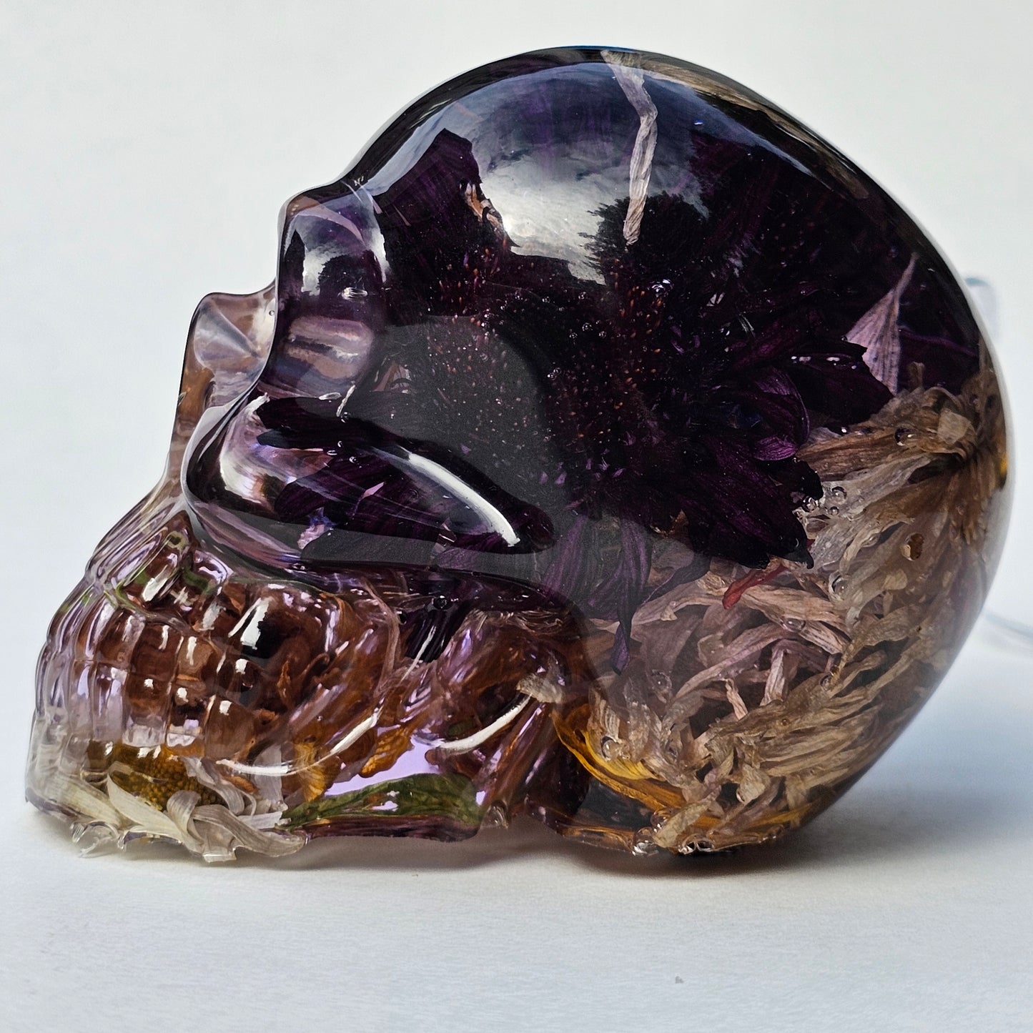 #0293- Handmade Resin Skull - Autumn flower blend in light purple resin. This one lights up! HAS LIGHTS!