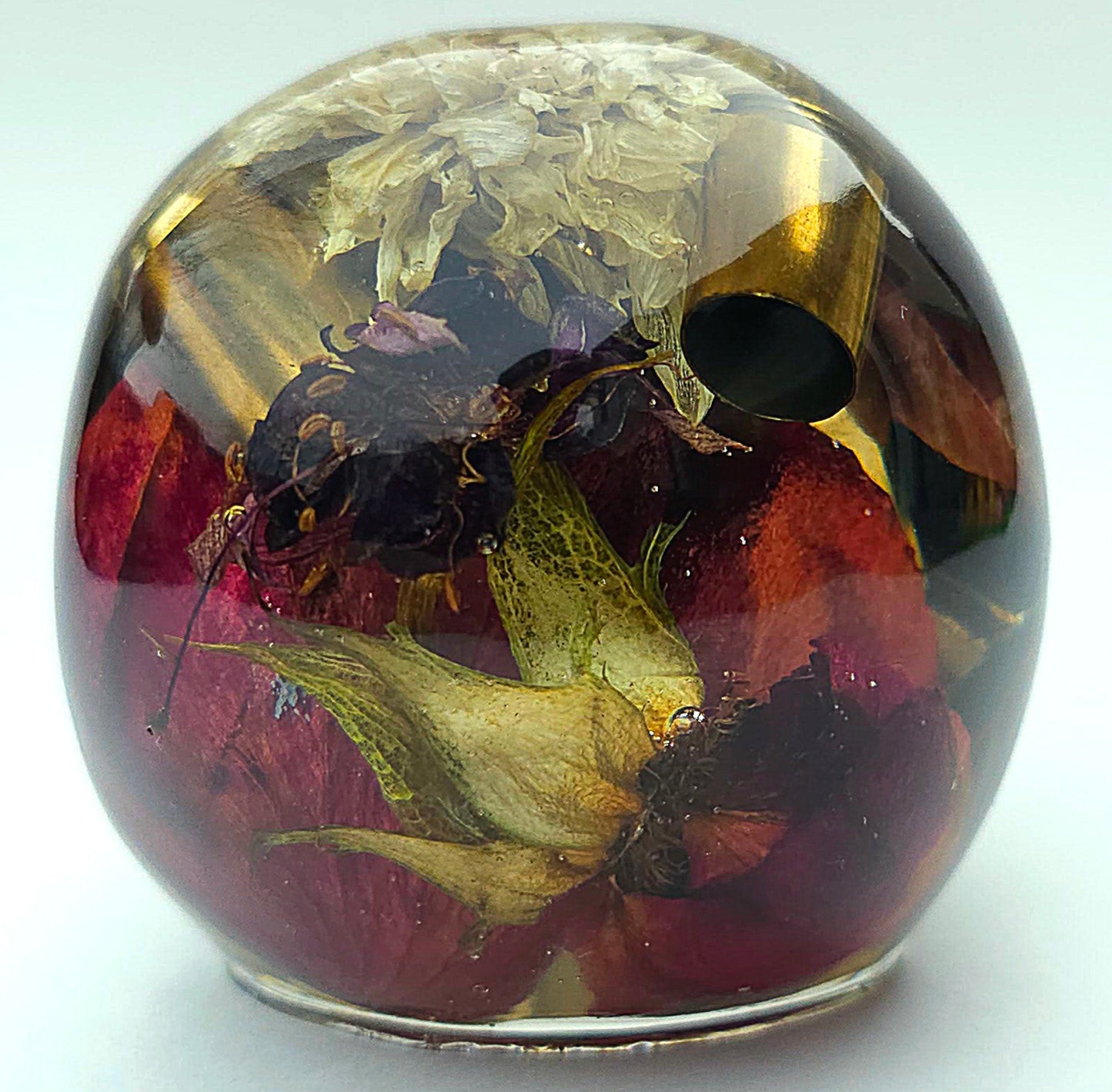 *SOLD*Handmade Resin Skull - With dried wild Rose and flowers. We've also added spent brass shells to help ground the piece and give it different twist.