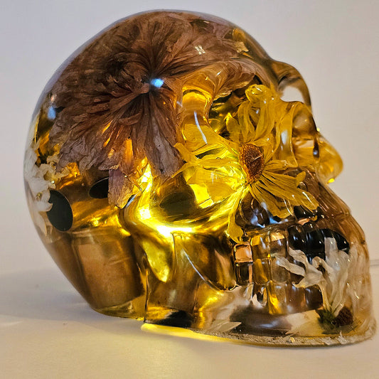 #0266 Handmade Resin Skull - Mixed flowers with brass in clear resin, very nice piece. HAS LIGHTS. Battery operated.
