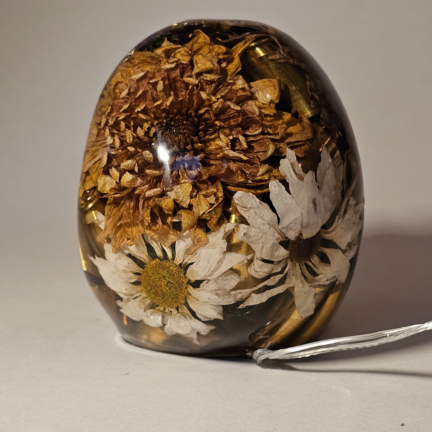 #0266 Handmade Resin Skull - Mixed flowers with brass in clear resin, very nice piece. HAS LIGHTS. Battery operated.