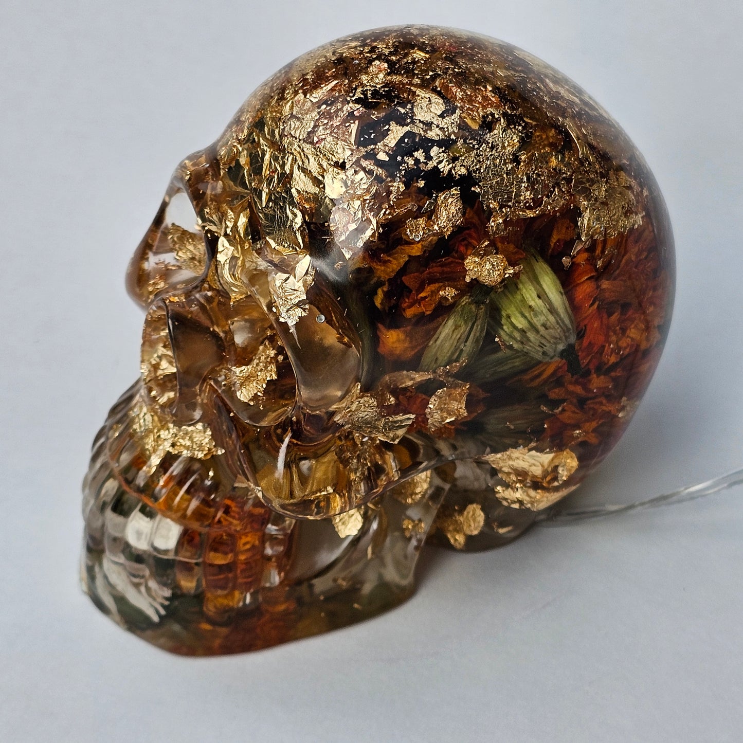 #0295 - Handmade Resin Skull - Autumn flower blend with gold foil. This one lights up! HAS LIGHTS!