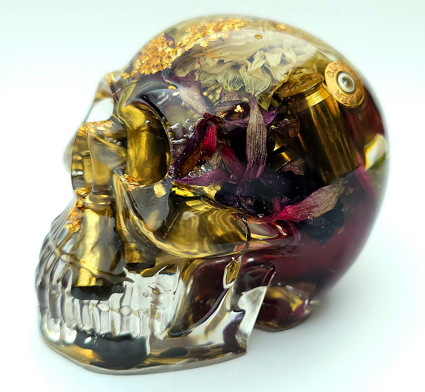 *SOLD*Handmade Resin Skull - With dried wild Rose and flowers. We've also added spent brass shells to help ground the piece and give it different twist.