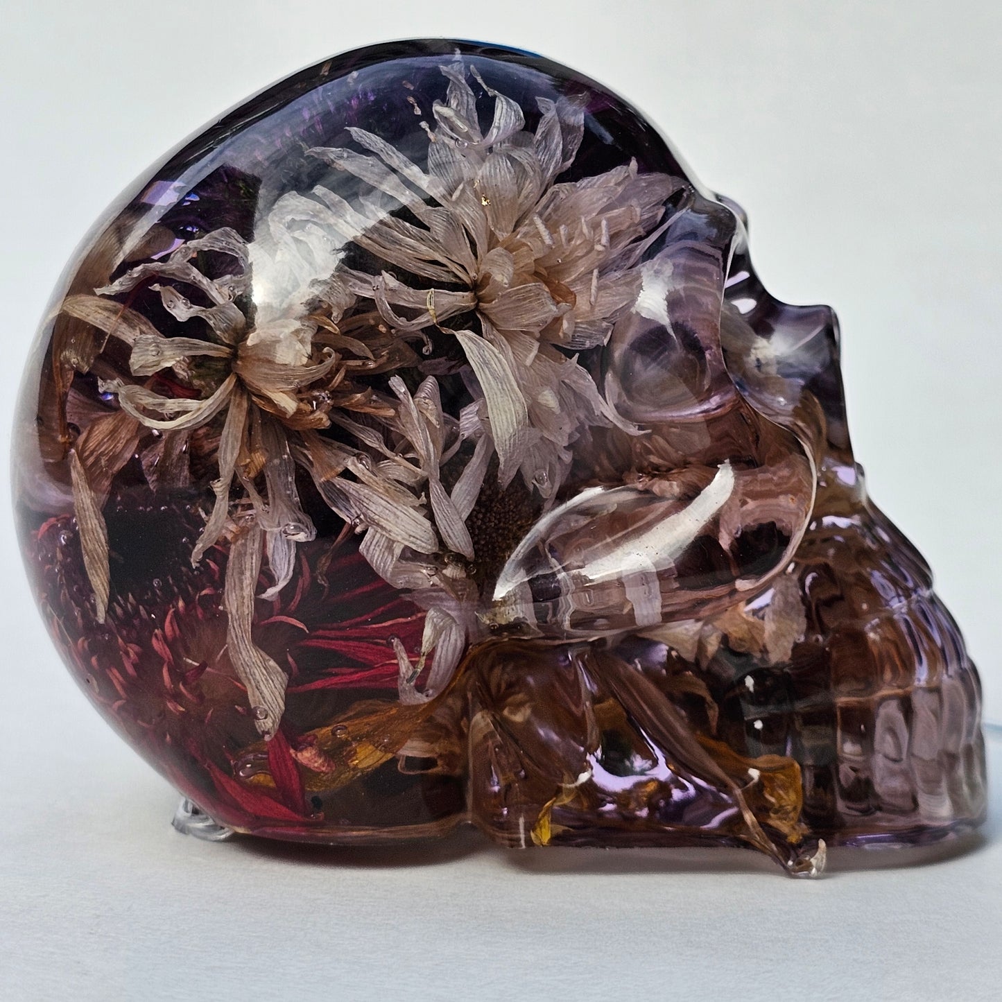 #0293- Handmade Resin Skull - Autumn flower blend in light purple resin. This one lights up! HAS LIGHTS!