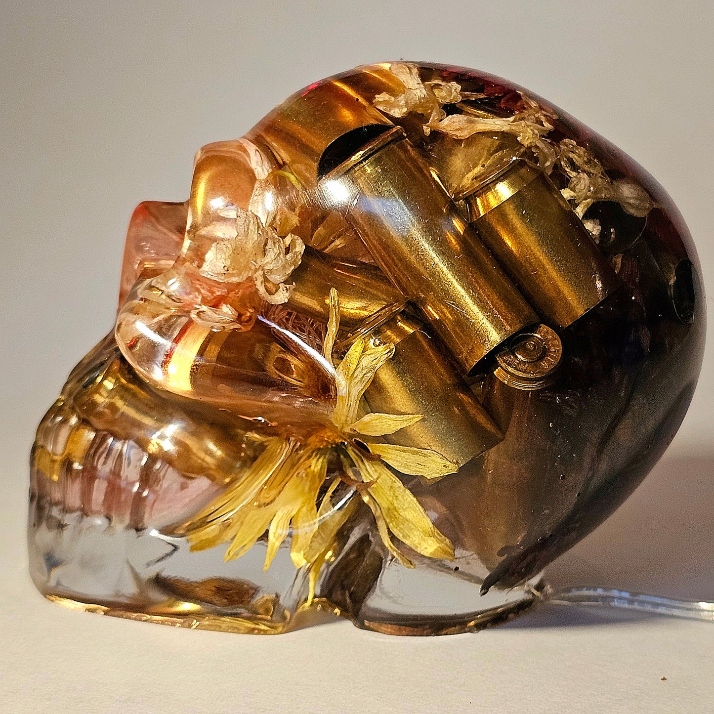 #0263 Handmade Resin Skull - Mixed flowers with brass in clear resin, very nice piece. HAS LIGHTS. Battery operated.