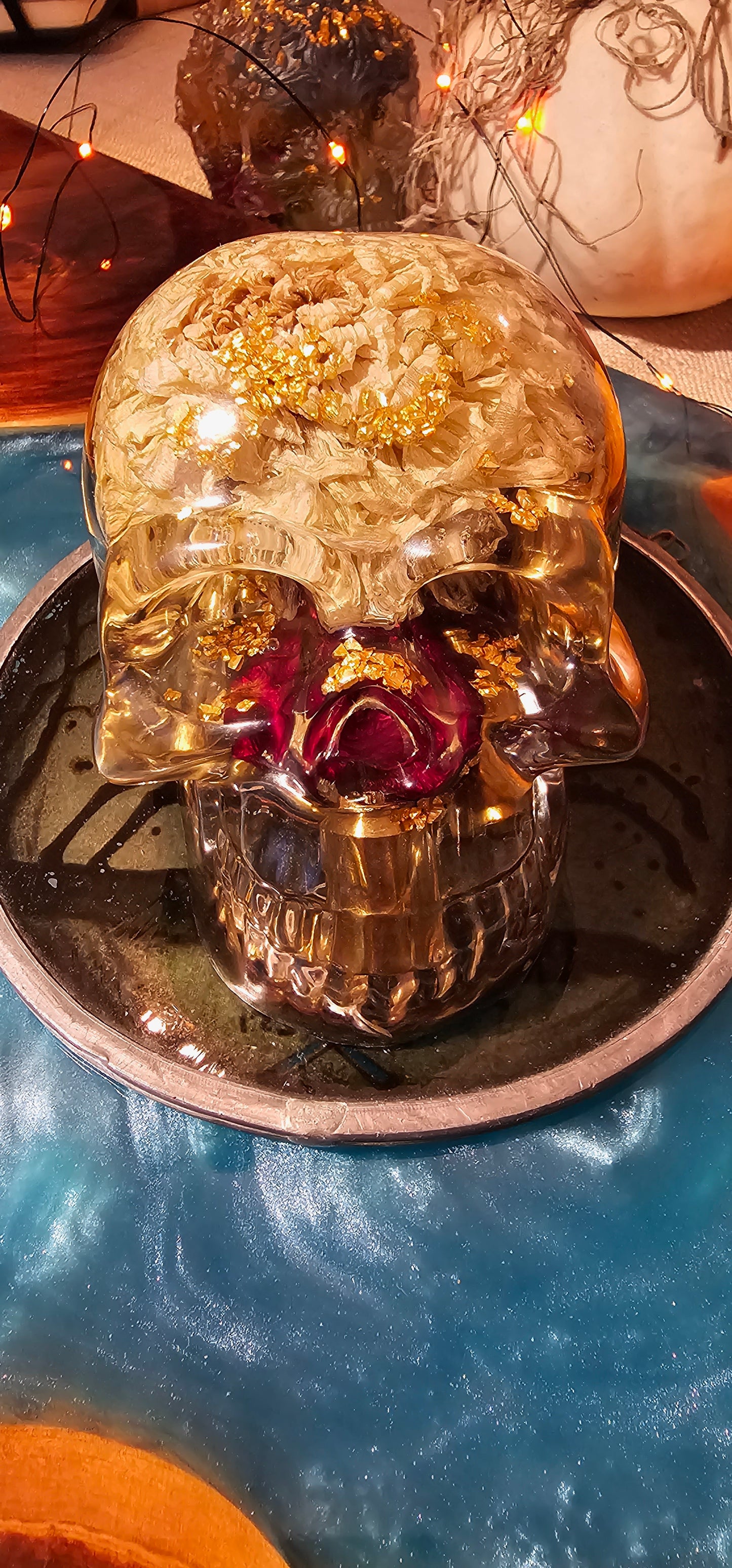 *SOLD*Handmade Resin Skull - With dried wild Rose and flowers. We've also added spent brass shells to help ground the piece and give it different twist.