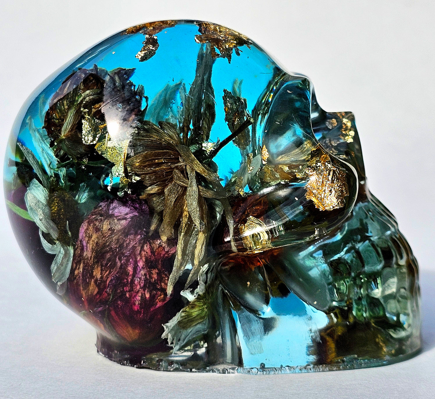 #0289 - Handmade Resin Skull - This one's a bit out there!  Fun piece as well, in blue resin accompanied by mixed flowers.