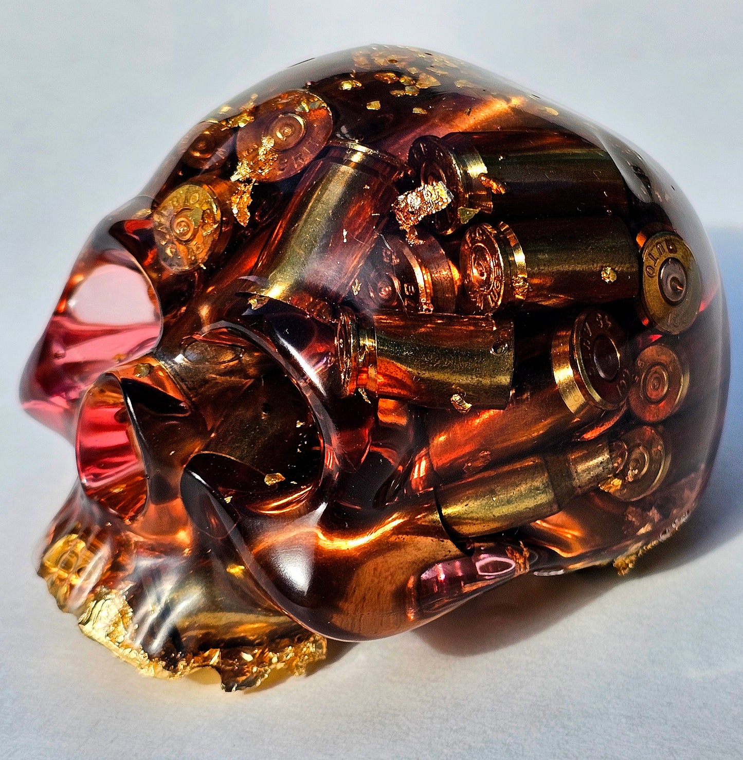 SOLD#0287 - Handmade Resin Skull -    We call it the "Halfer". Fun piece, in red resin with brass hanging out the bottom. Gold accents.