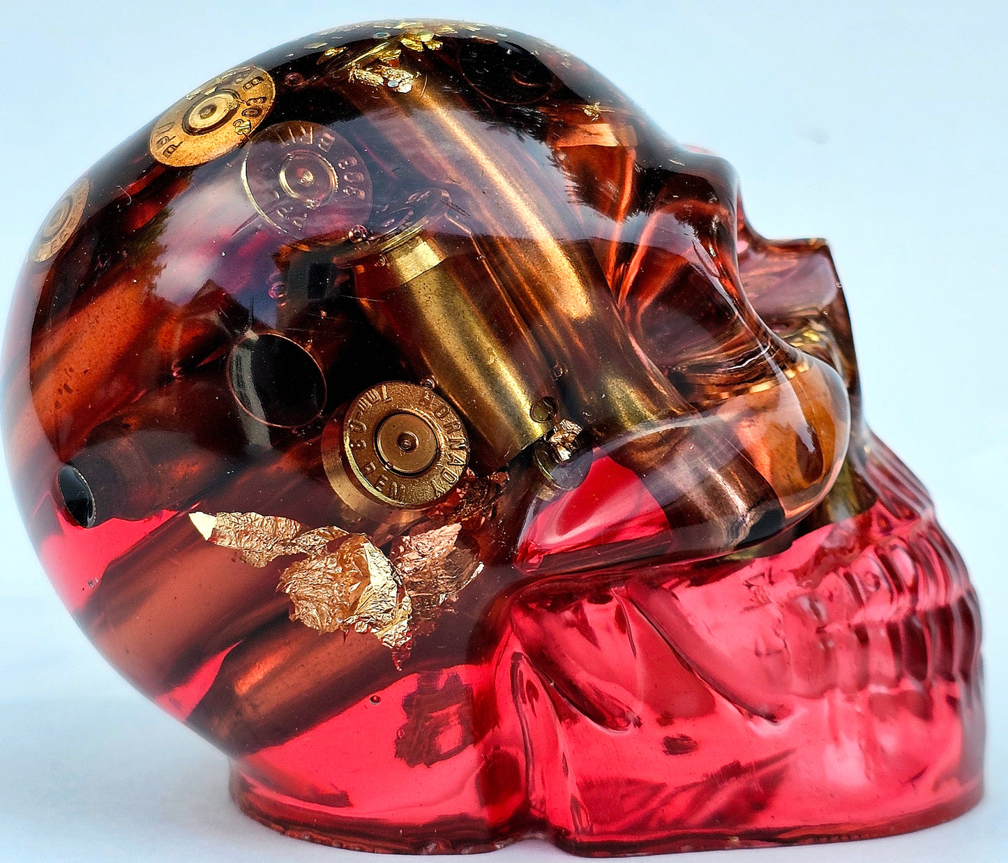 #0276 Handmade Resin Skull - Brass in red resin with gold accents