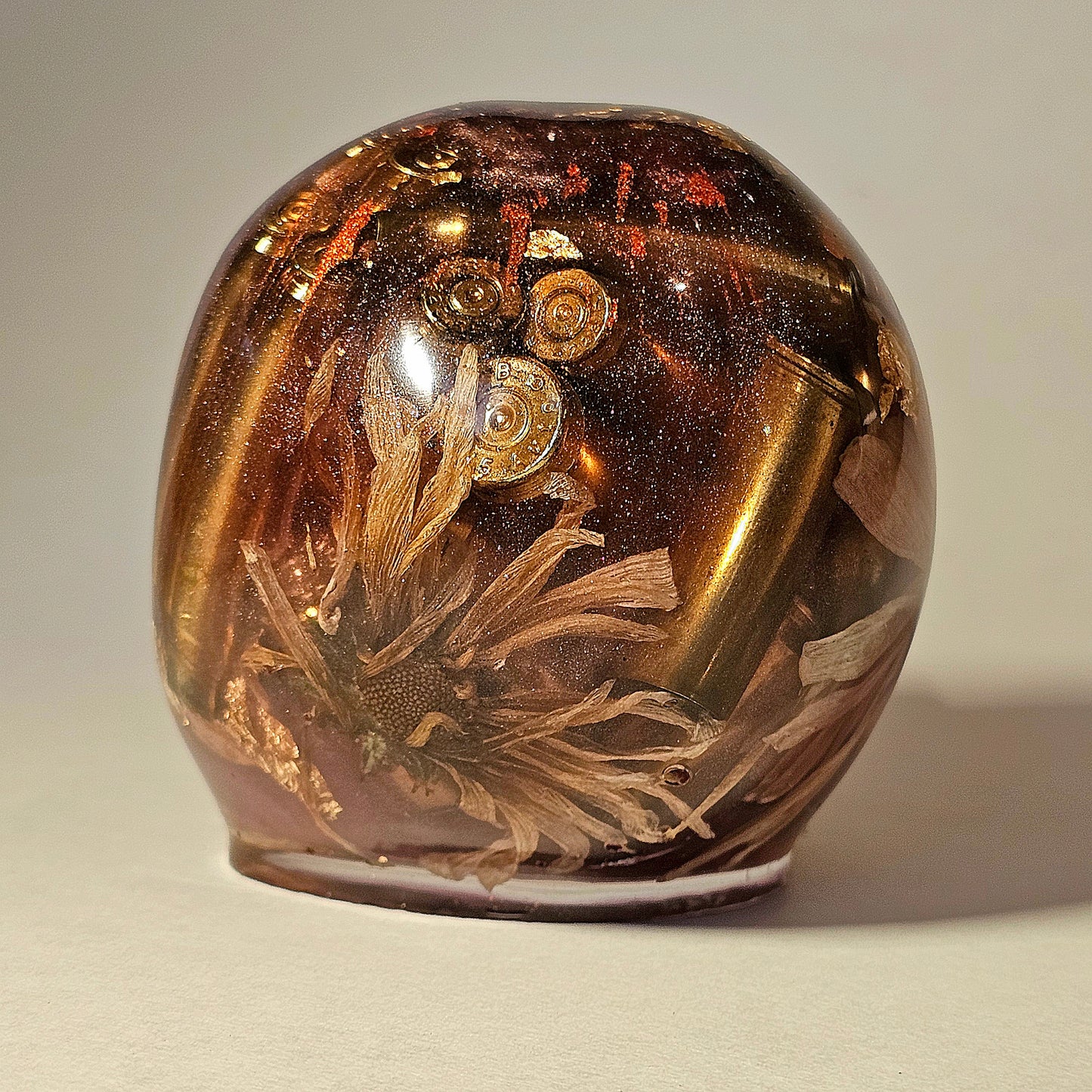 #0261 Handmade Resin Skull - Mixed flowers in warm light red resin.