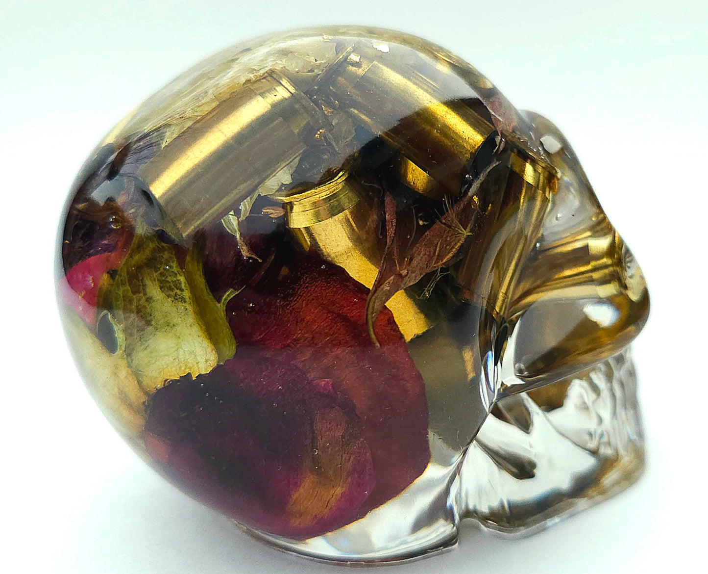 *SOLD*Handmade Resin Skull - With dried wild Rose and flowers. We've also added spent brass shells to help ground the piece and give it different twist.