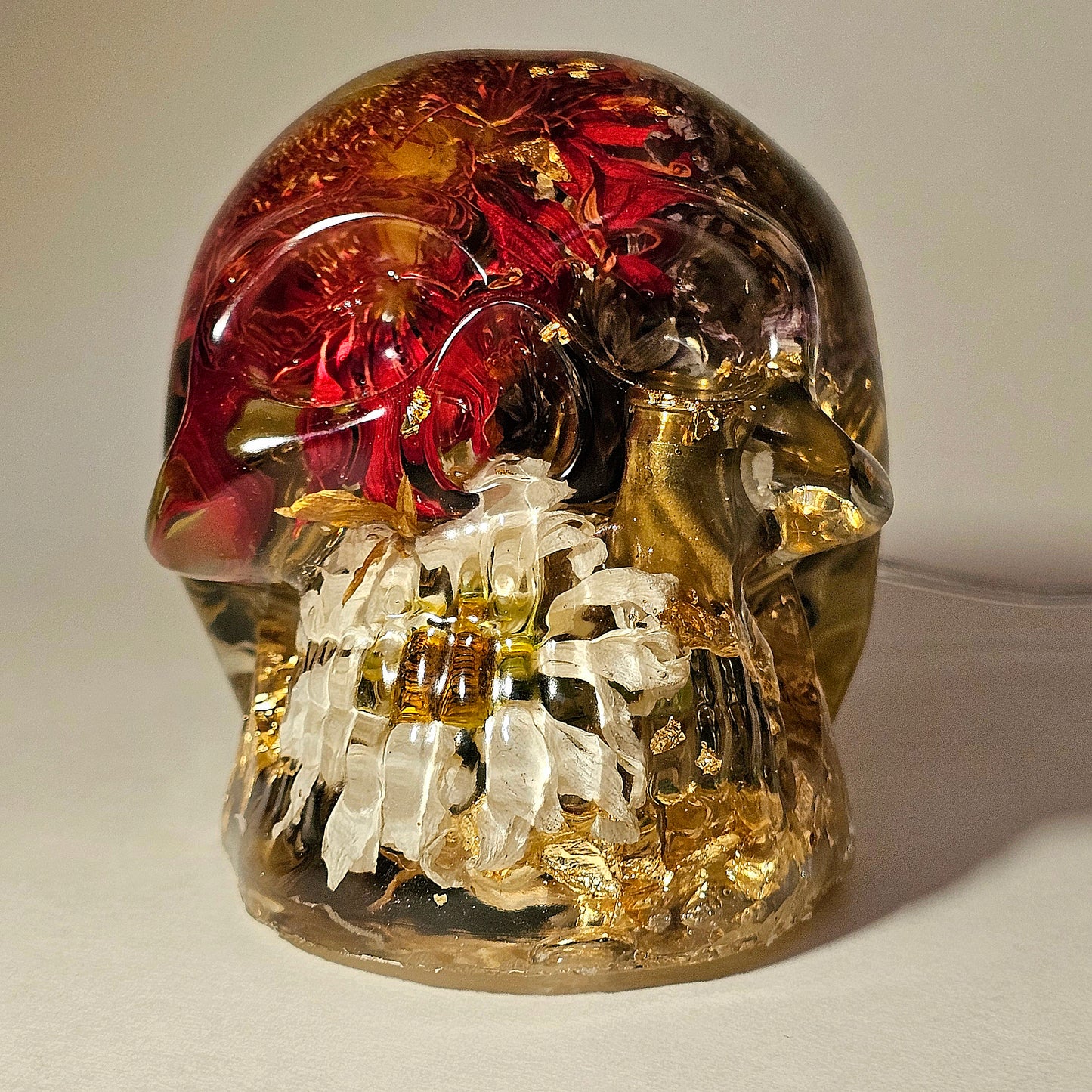 #0270 Handmade Resin Skull - Mixed flowers in clear resin. HAS LIGHTS. Battery operated.