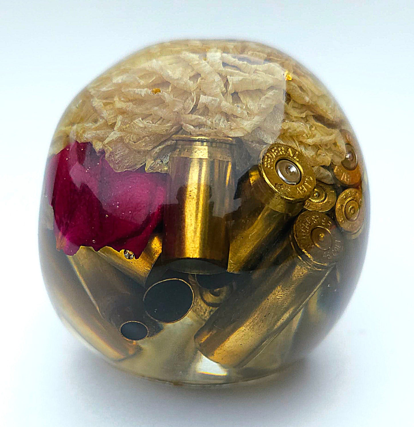 SOLD*Handmade Resin Skull- With wild dried Hydrangea flower mixture.  We've also added spent brass shells to help ground the piece some contrast.