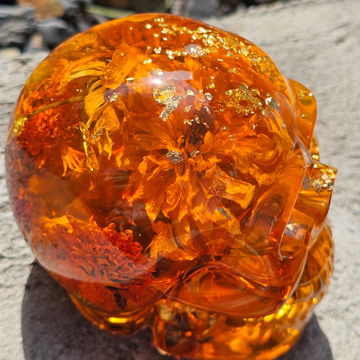 #0281 Handmade Resin Skull - Sunflowers and Marigolds in a warm orange resin.