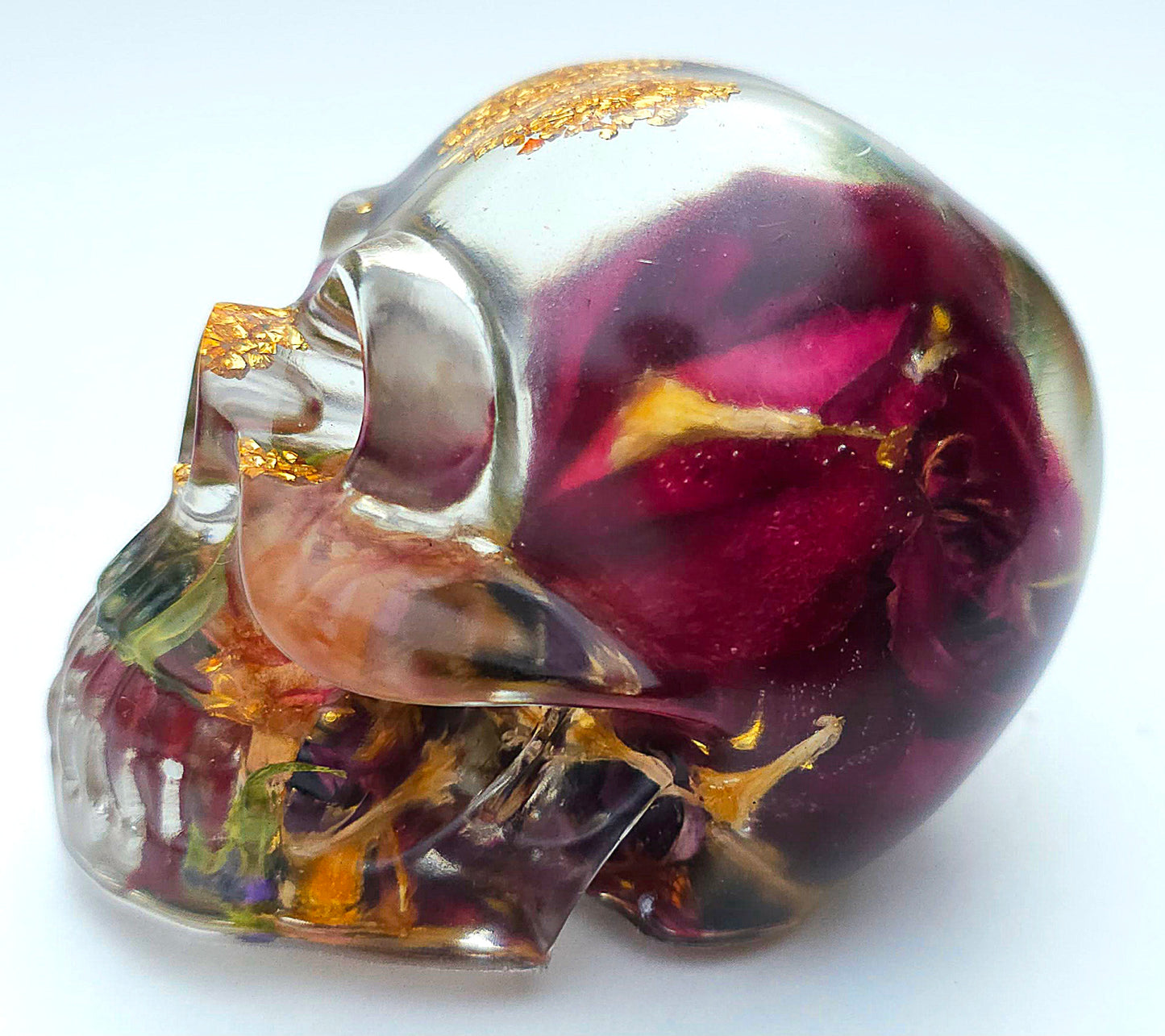 *SOLD*Handmade Resin Skull- Large wild Rose, with flower mixture. Discounted price. This piece came out quite cloudy.