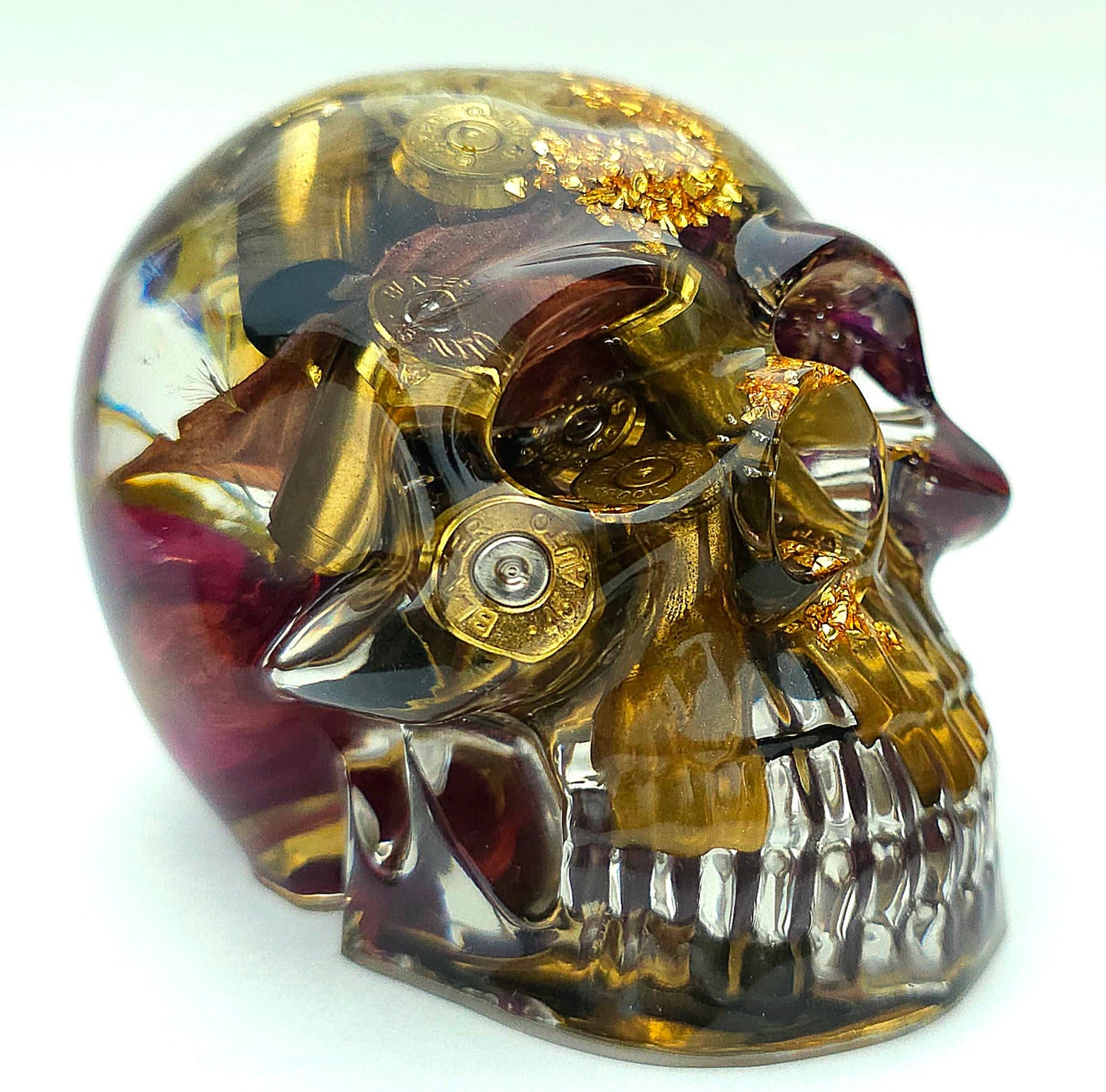*SOLD*Handmade Resin Skull - With dried wild Rose and flowers. We've also added spent brass shells to help ground the piece and give it different twist.