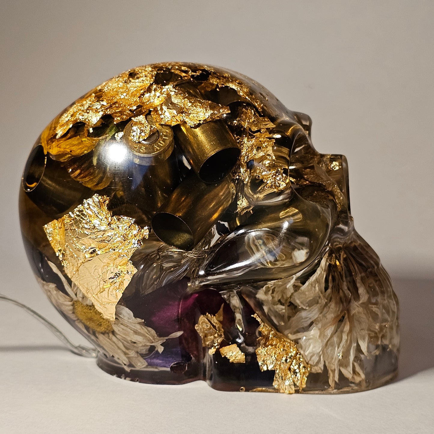 #0268 Handmade Resin Skull - Mixed flowers and brass in clear resin. HAS LIGHTS. Battery operated.