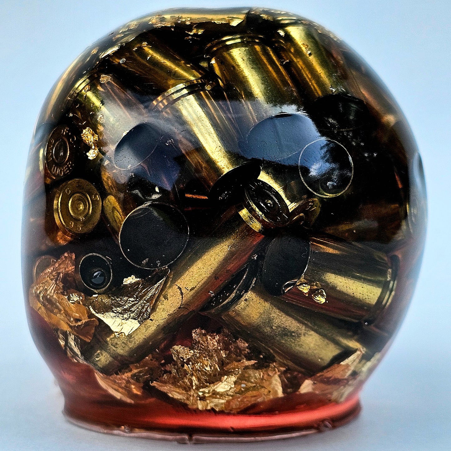 SOLD #0277 Handmade Resin Skull - Brass in red resin with gold accents
