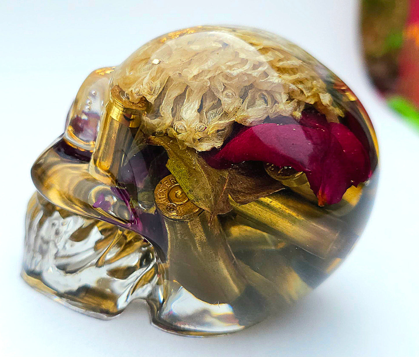 SOLD*Handmade Resin Skull- With wild dried Hydrangea flower mixture.  We've also added spent brass shells to help ground the piece some contrast.