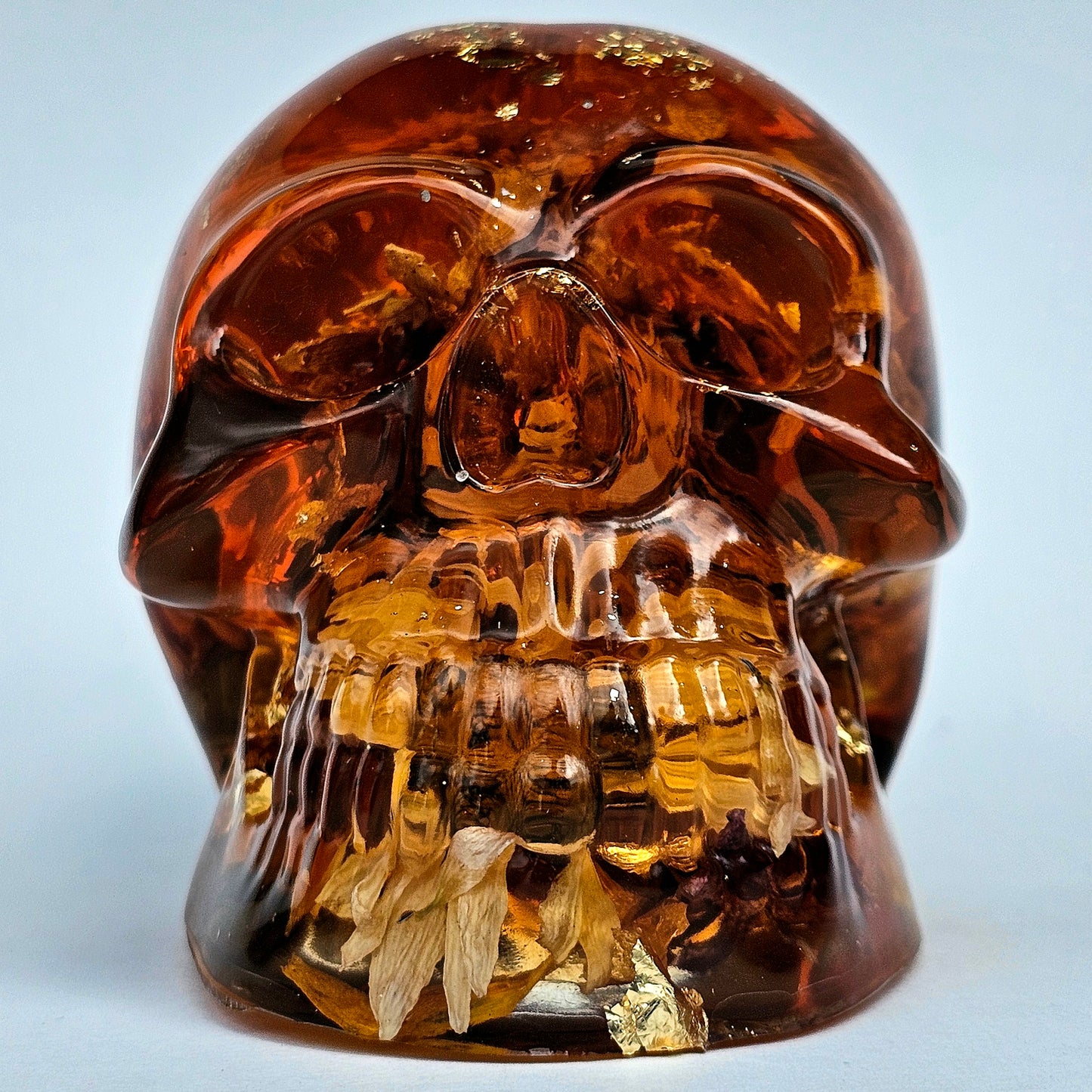 #0281 Handmade Resin Skull - Sunflowers and Marigolds in a warm orange resin.