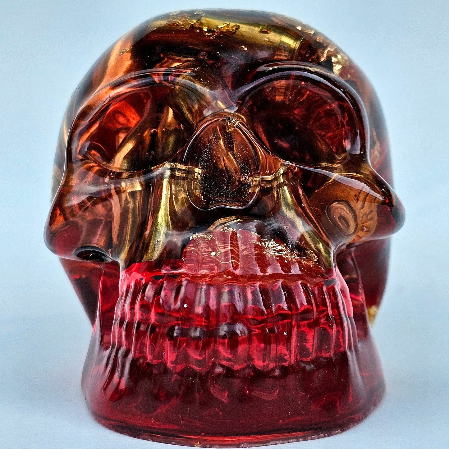 #0276 Handmade Resin Skull - Brass in red resin with gold accents