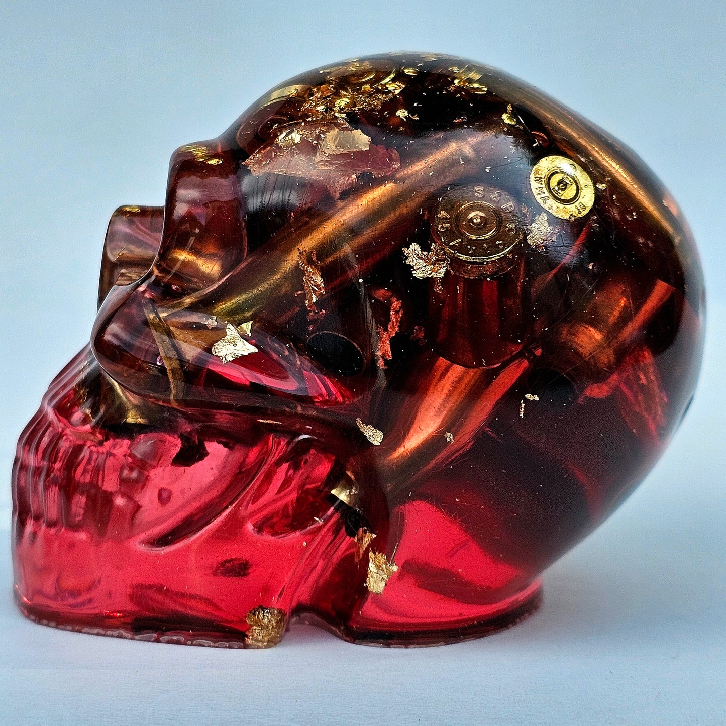 #0276 Handmade Resin Skull - Brass in red resin with gold accents