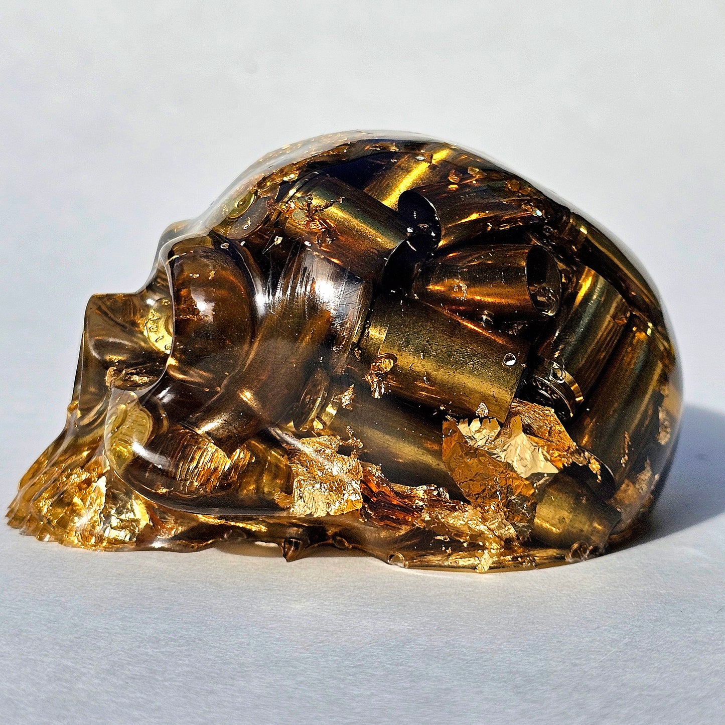 SOLD #0288 - Handmade Resin Skull -    We call it the "Halfer". Fun piece, in clear resin with brass hanging out the bottom. Gold accents.