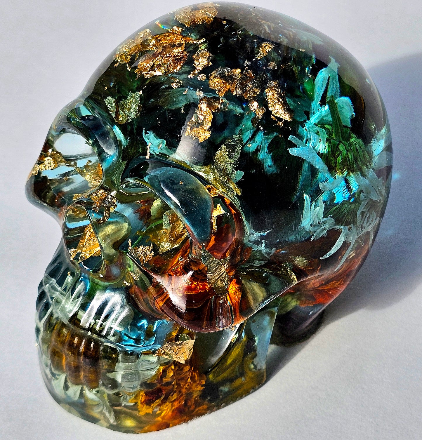 #0289 - Handmade Resin Skull - This one's a bit out there!  Fun piece as well, in blue resin accompanied by mixed flowers.