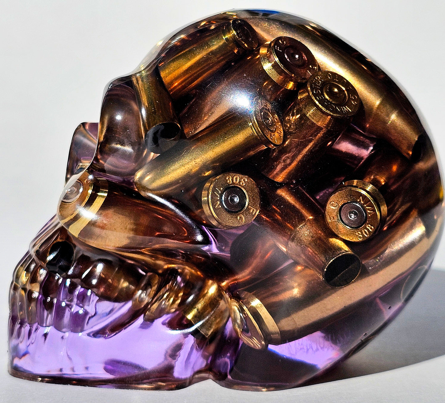 #0284 - Handmade Resin Skull - Mixed large calibre brass, in a light purple resin.