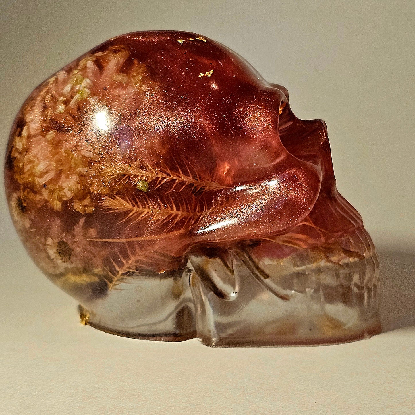 #0260 Handmade Resin Skull - Mixed flowers in warm light red resin.