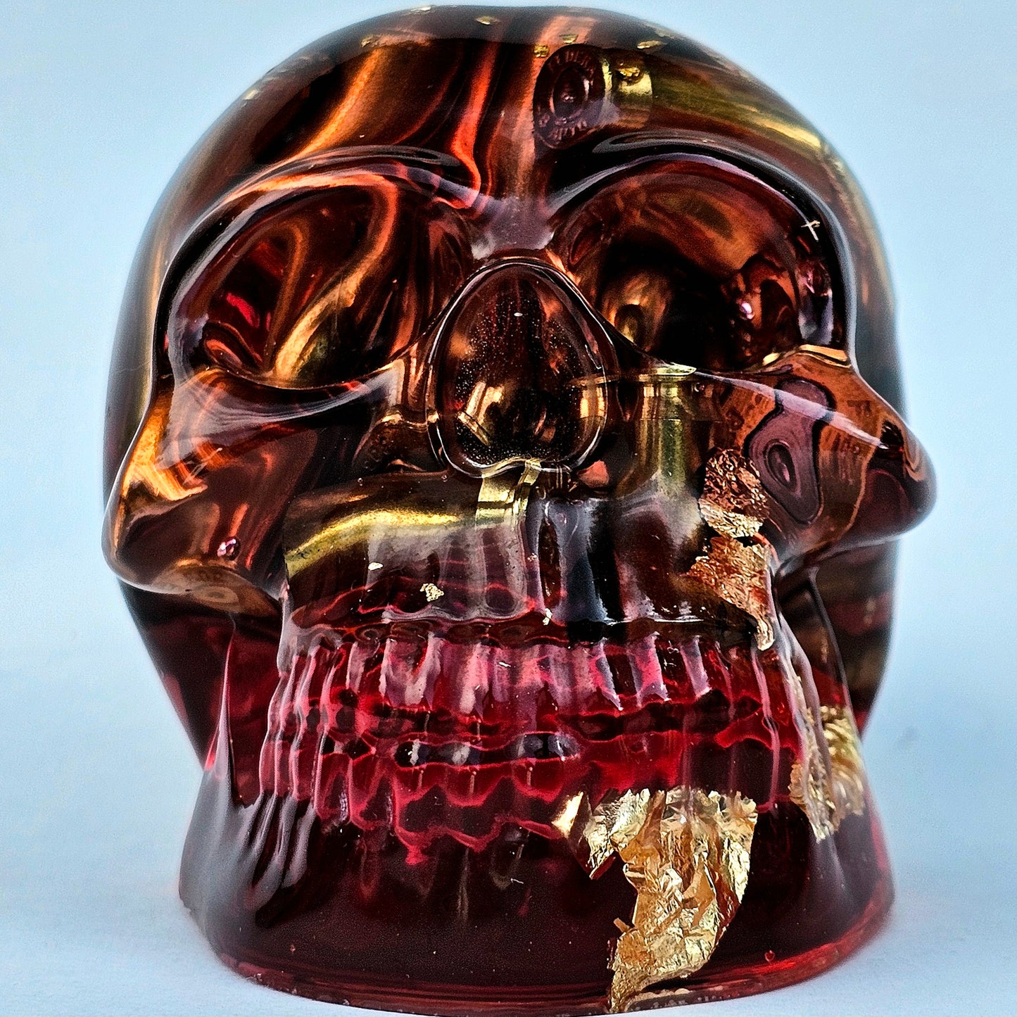 #0278 Handmade Resin Skull - Brass in red resin with gold accents