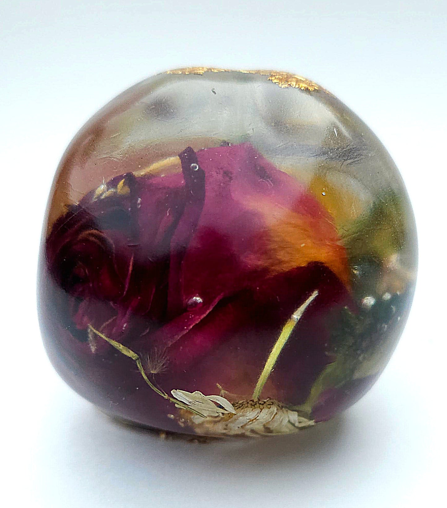 *SOLD*Handmade Resin Skull- Large wild Rose, with flower mixture. Discounted price. This piece came out quite cloudy.