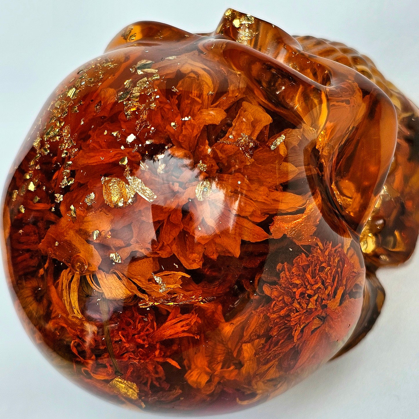 #0281 Handmade Resin Skull - Sunflowers and Marigolds in a warm orange resin.