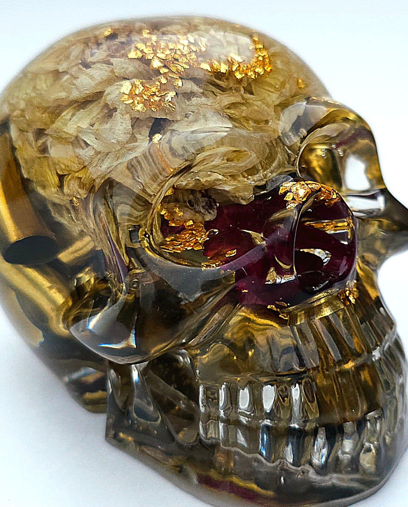 SOLD*Handmade Resin Skull- With wild dried Hydrangea flower mixture.  We've also added spent brass shells to help ground the piece some contrast.