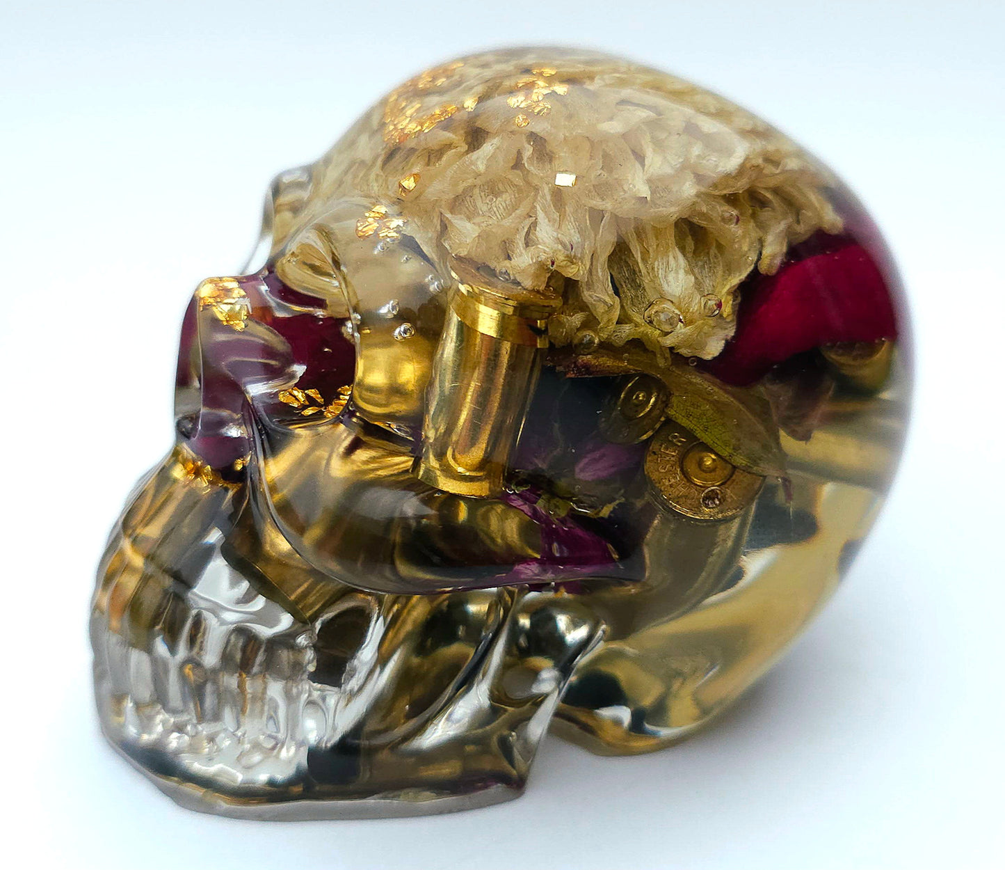 SOLD*Handmade Resin Skull- With wild dried Hydrangea flower mixture.  We've also added spent brass shells to help ground the piece some contrast.